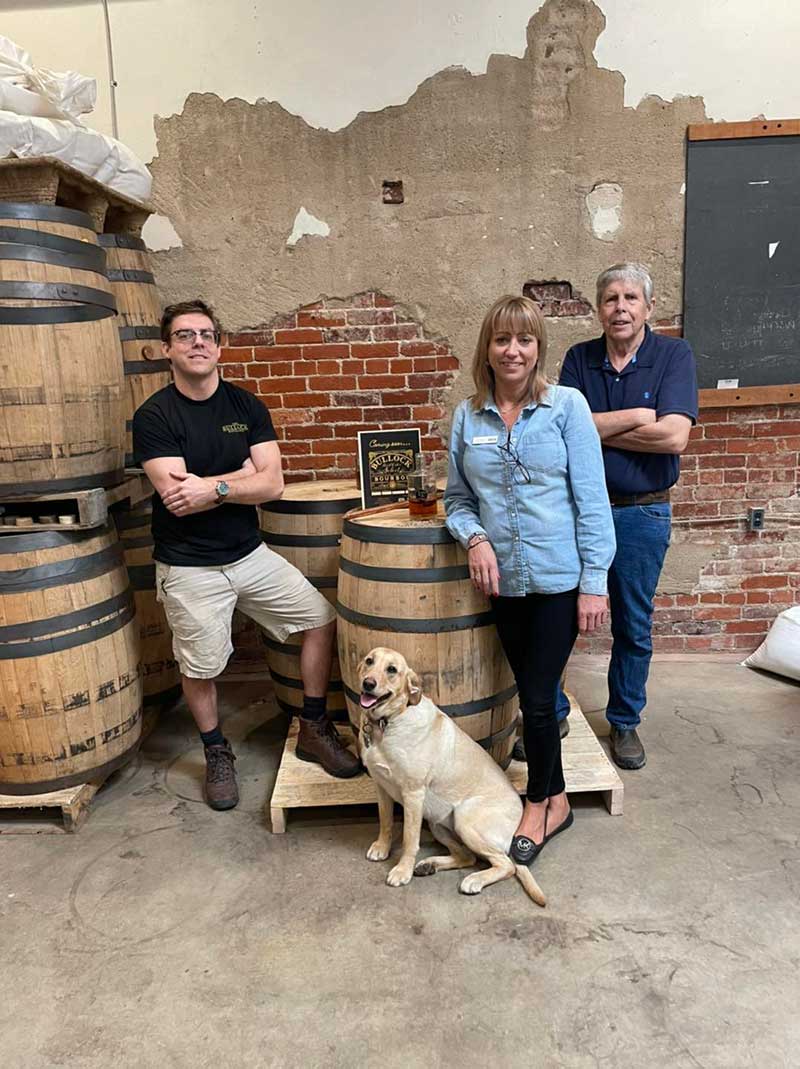 Bullock family with bourbon barrels